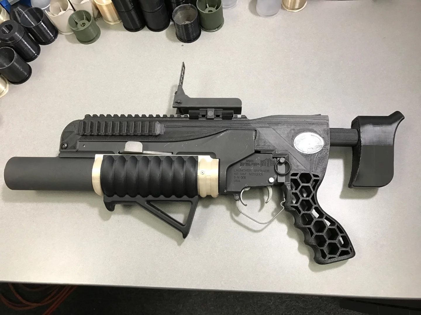 The additive-manufactured RAMBO system includes an NSRDEC-designed standalone kit with printed adjustable buttstock, mounts, grips and other modifications