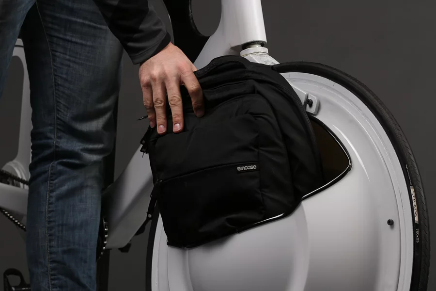 The Transport's front wheel is fitted with an open compartment made from lightweight PET-G plastic that's large enough to hold most backpacks