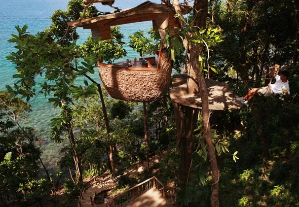 The pod is constructed with a rigid frame that is wrapped in woven rattan and can accommodate up to four diners
