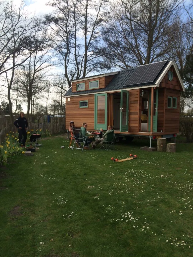 The home is clad in red cedar, with a traditional but easy on the eyes tiny house design