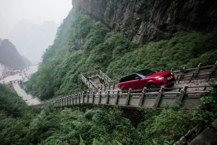In a stunt unlikely to be repeated, Ho-Pin Tung drives a range rover up the staircase to Heaven's Gate