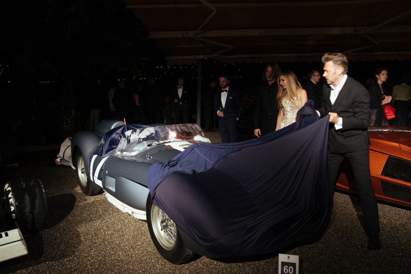 Andreas Mohringer's 1958 Ferrari 335 Sport Spider got caught in the rain without a cover during the black tie awards dinner.