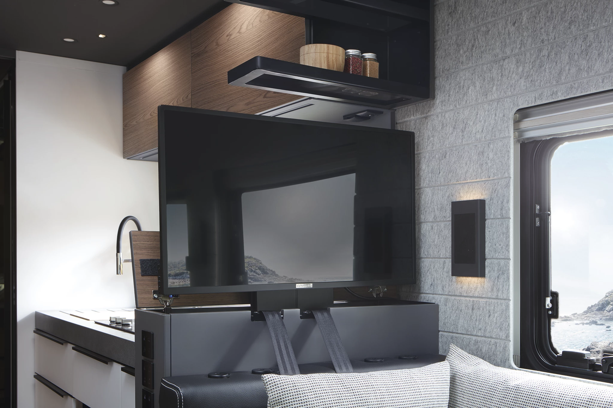 The available 32-in TV pops up at the push of a button and lowers away when not in use