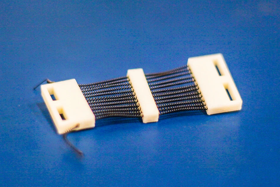A close-up view of a 3D-printed shape memory alloy (SMA) cartridge
