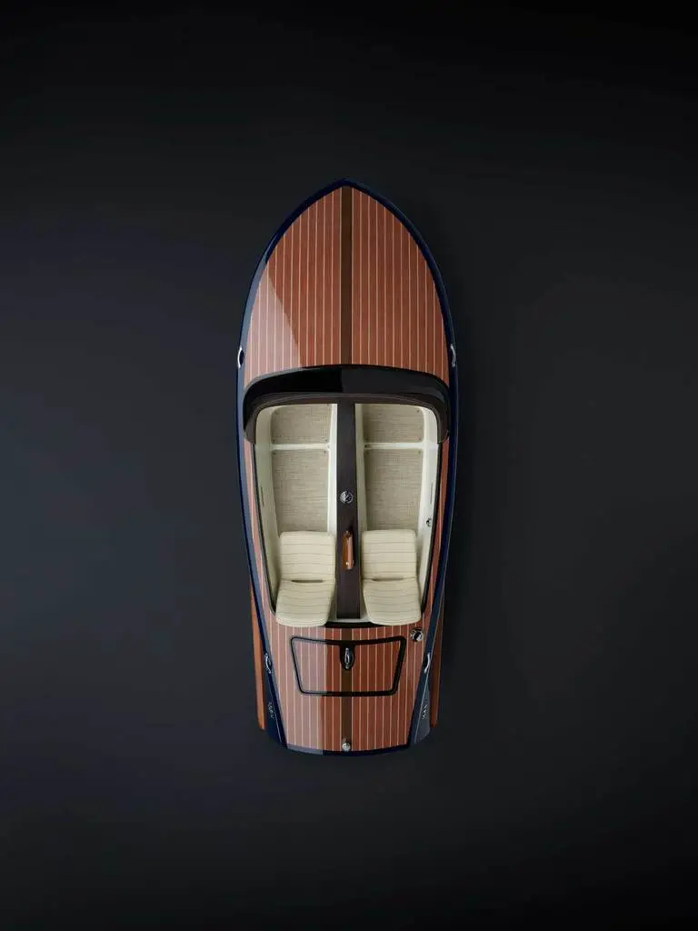 The boats feature a lightweight molded fiberglass hull with infused real wood, cockpit, and inlaid veneer deck