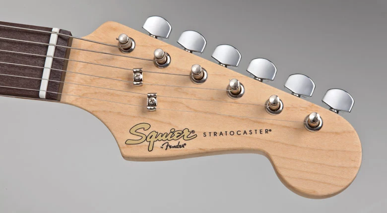 The enclosed tuners sit on a familiar Strat headstock - players don't need to tune up to play the game but it's probably a good habit to get into