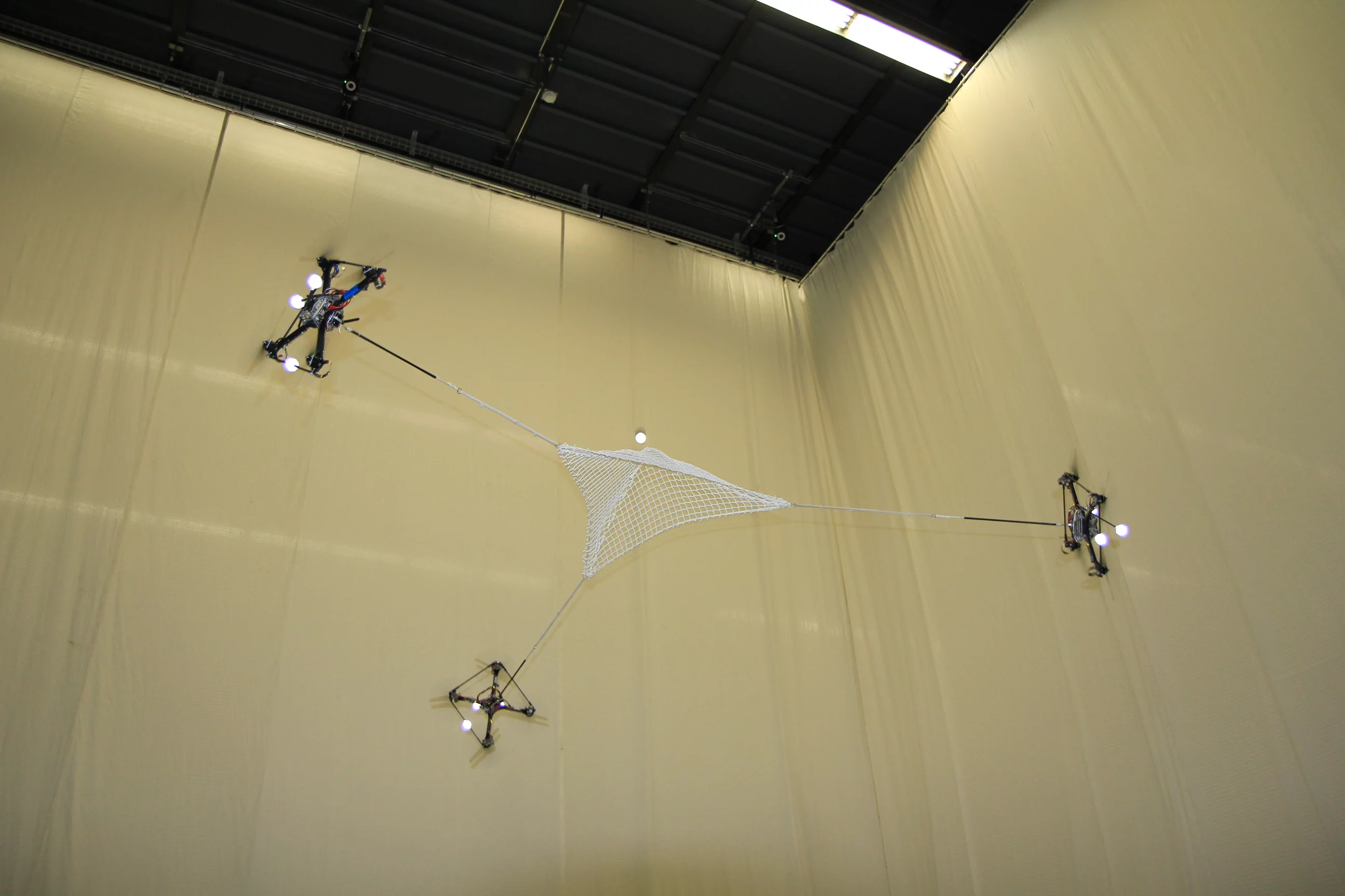 Flying quadrocopters at ETH Zurich's Flying Machine Arena play catch