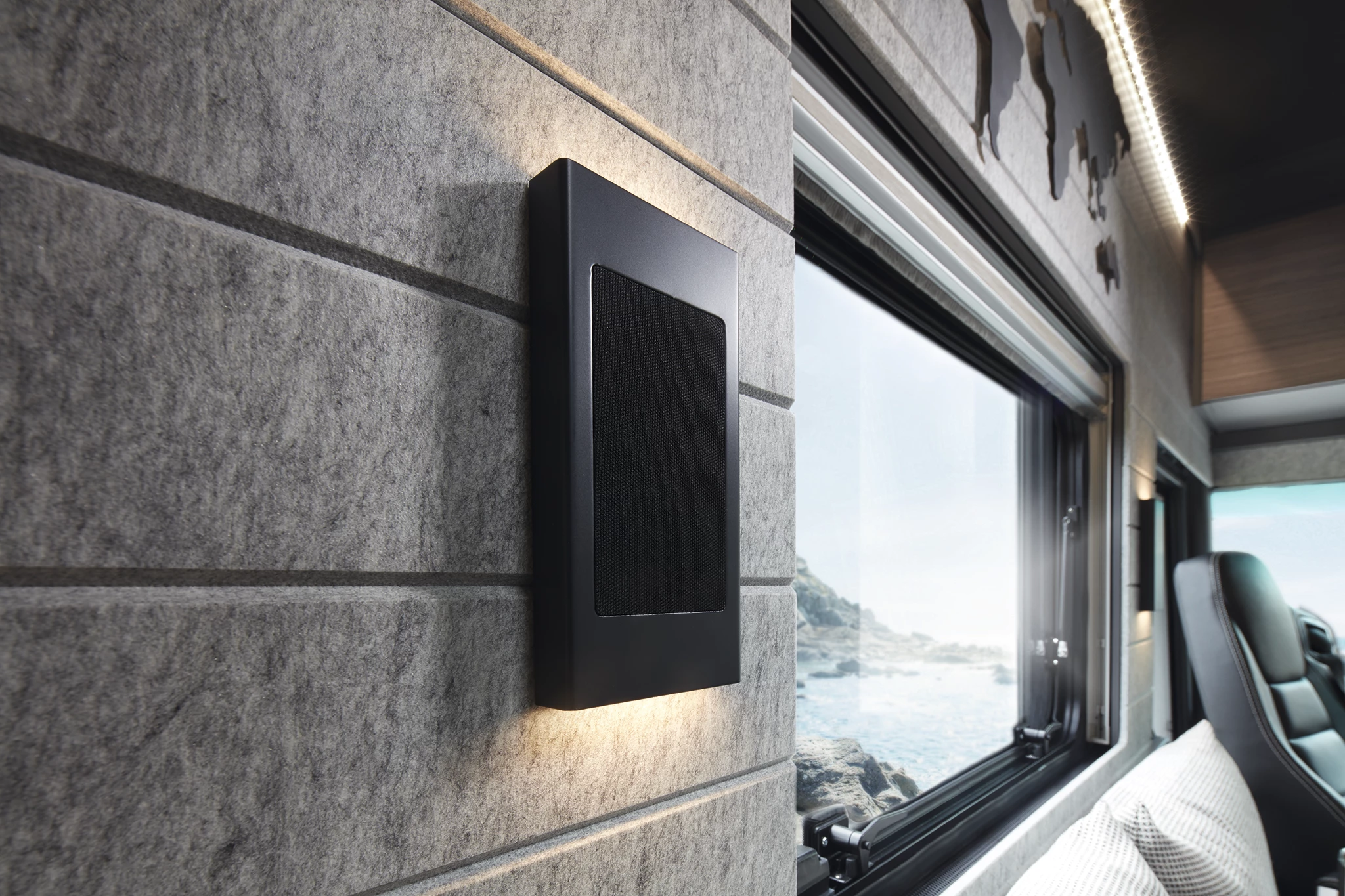 The sleek lighting sconces are also speakers