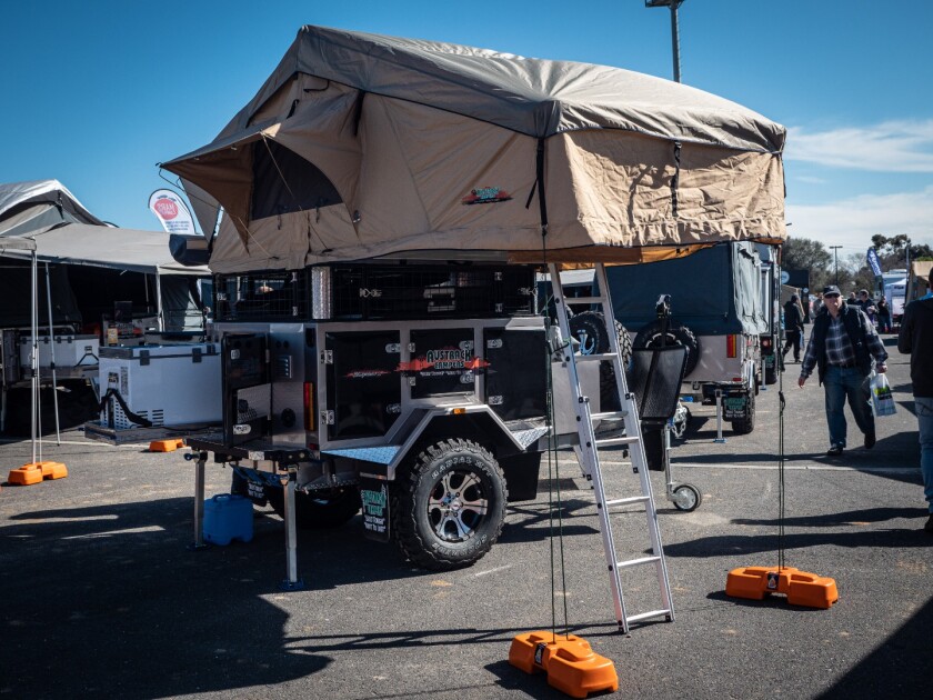 Austrack's tiny AU$17,990 Simpson is a Swiss army knife of a camper trailer, with fridges, cooking gear, 100 liters of water, a rooftop tent, awnings, hot shower, portaloo and a stereo