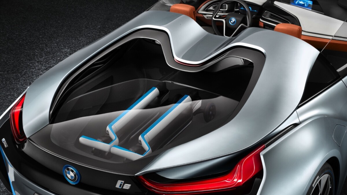 BMW's i8 Spyder with two matching BMW three-wheeled electric kick scooters in the rear