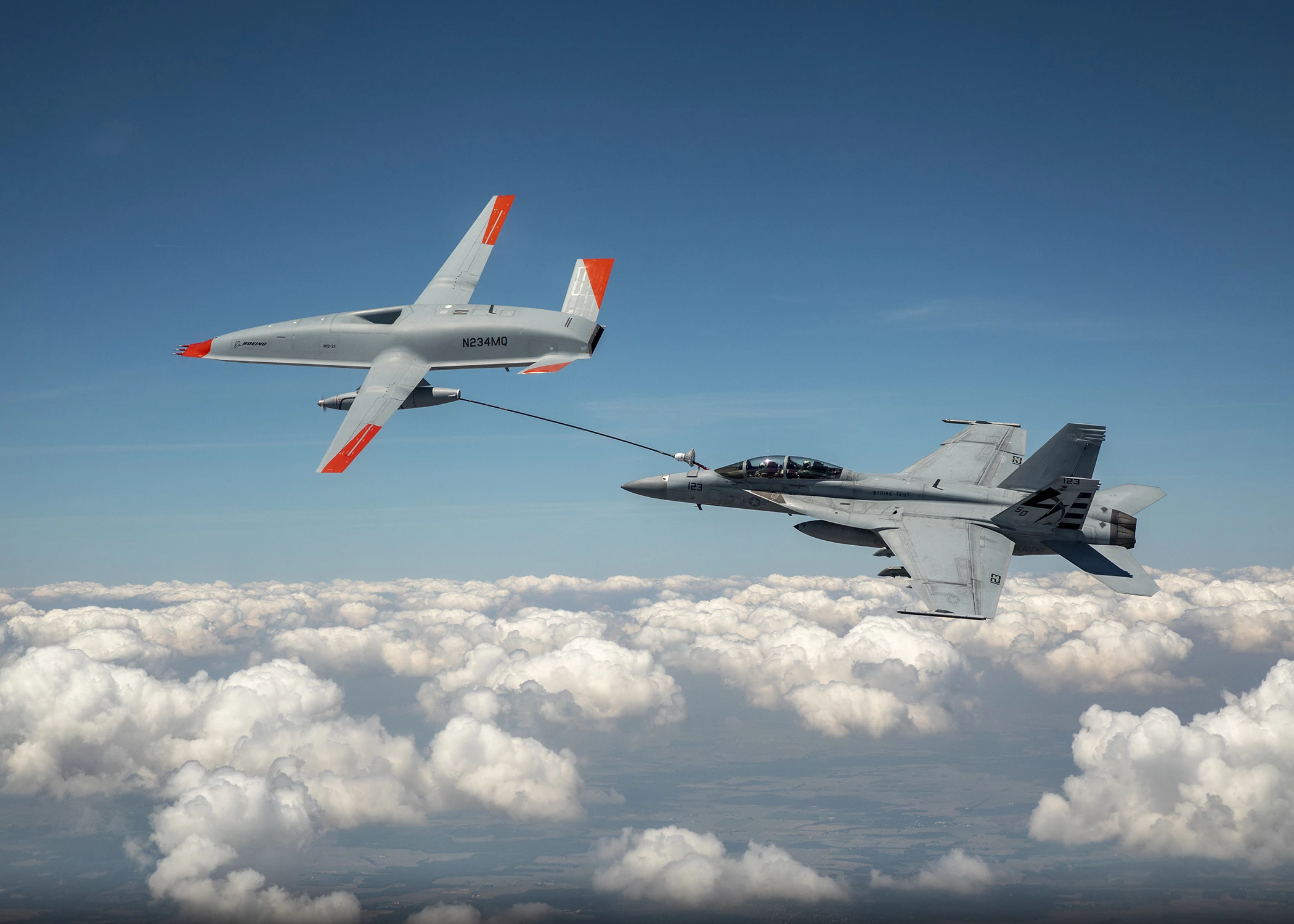 The MQ-25 T1 and the F/A-18 Super Hornet, connected via the drone's fuel hose