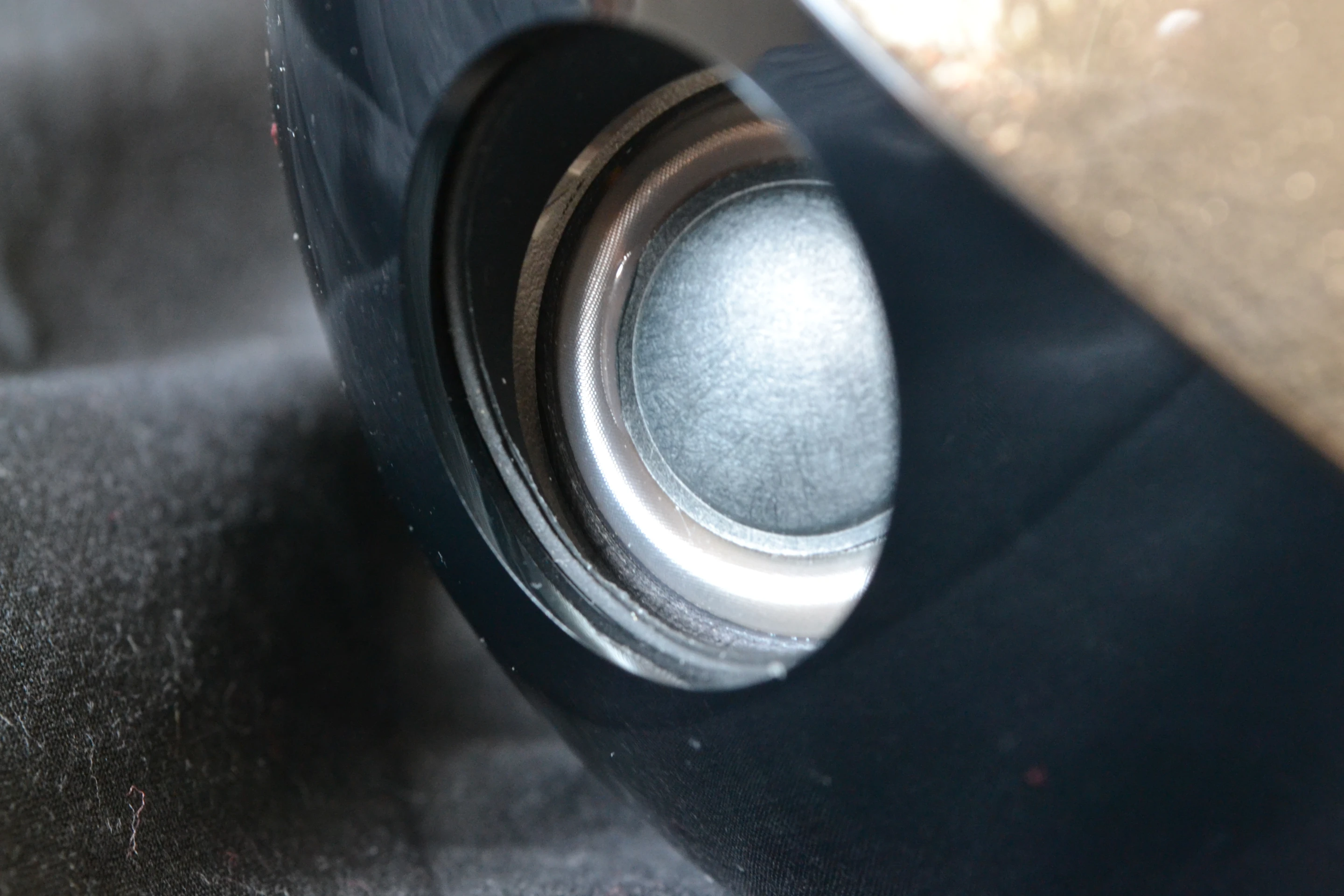 Though the manufacturer advises against touching the exposed speakers, it is rather difficult not to at least brush them as you pick up the unit and your fingers naturally head for the bowling-ball-like holes in the housing