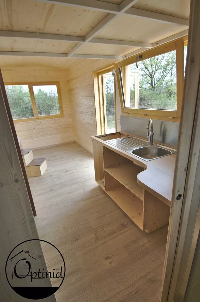 The Marie Ange's kitchen has a sink and cabinetry, as well as space for a fridge and oven