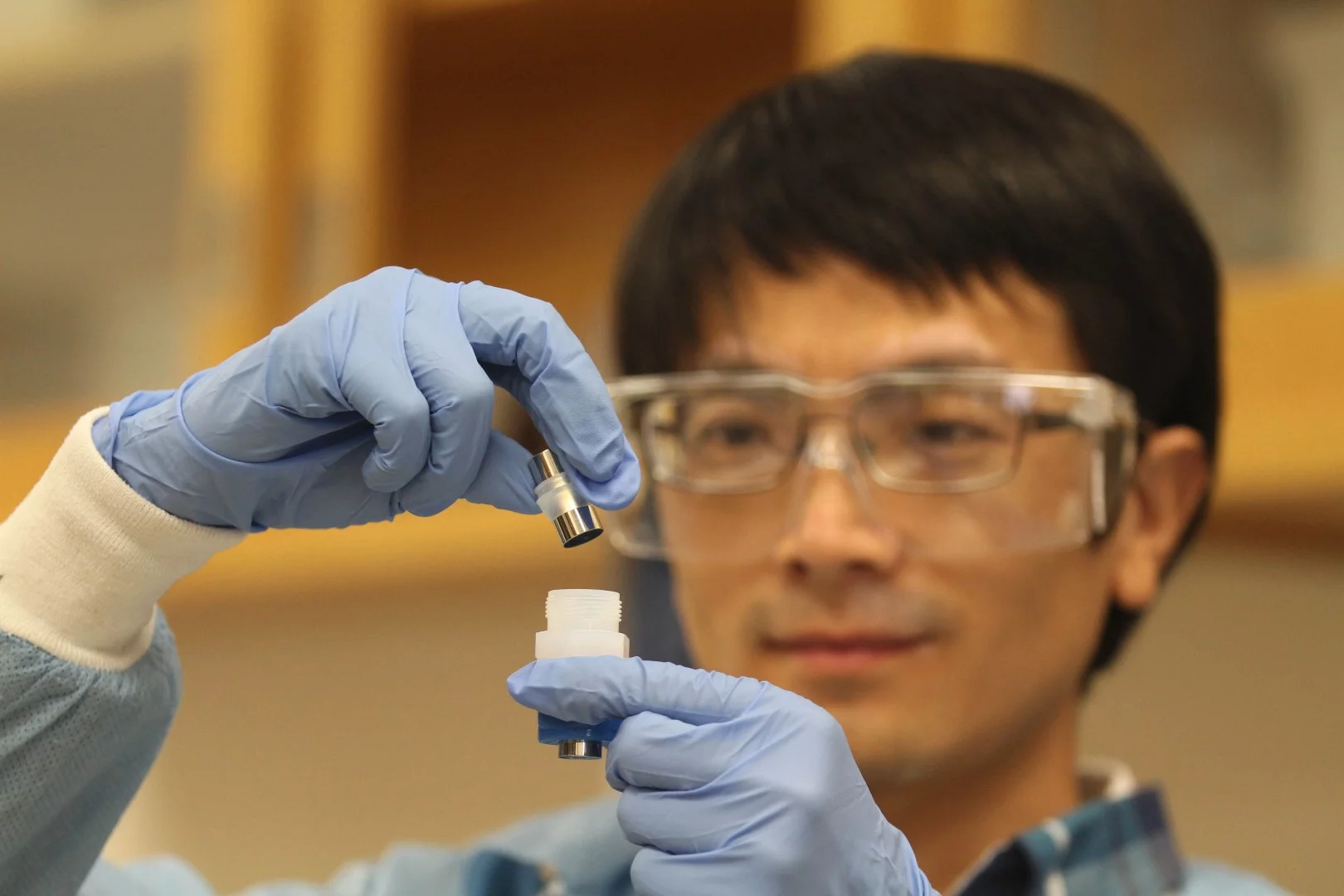 LLNL postdoc Jianchao Ye with the improved lithium ion battery