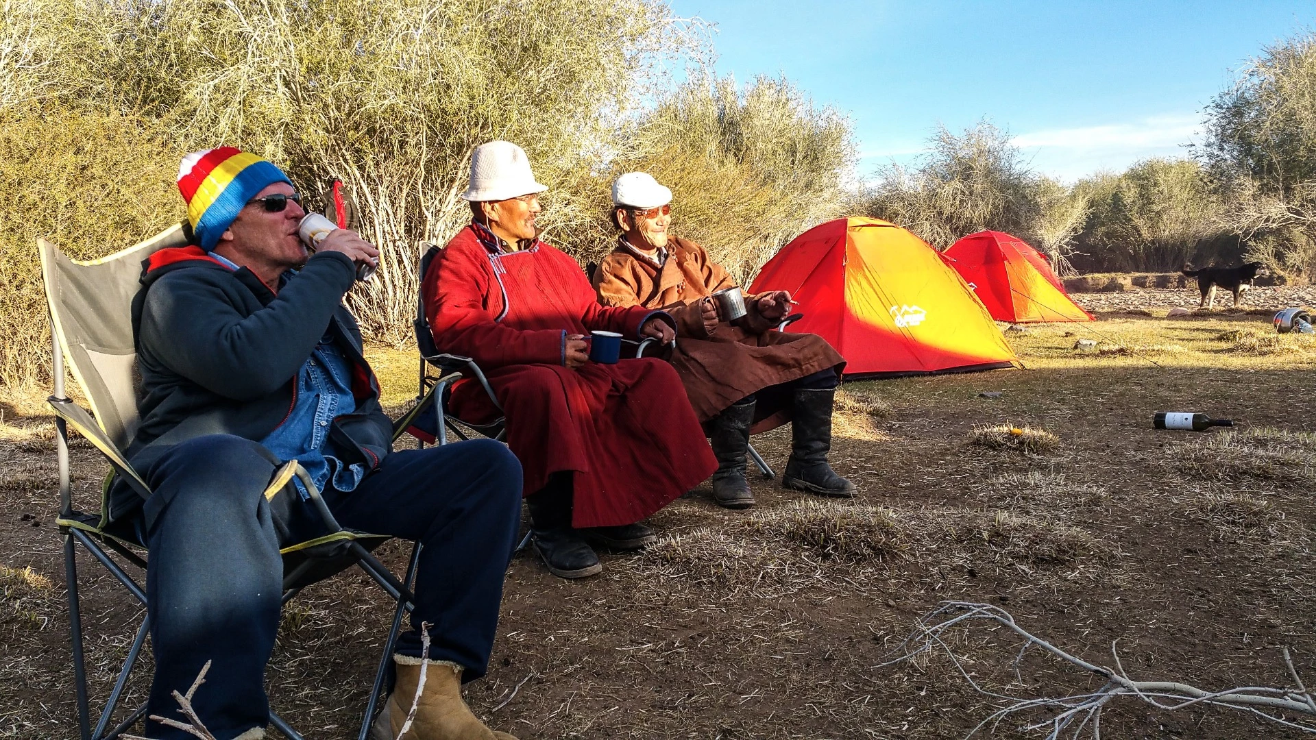 After making camp, it was common for local herders to come and join us for a mug of vodka and a feed. This spot was also remarkable for the fact that it had a few trees sitting around. Near Tsaaganuur