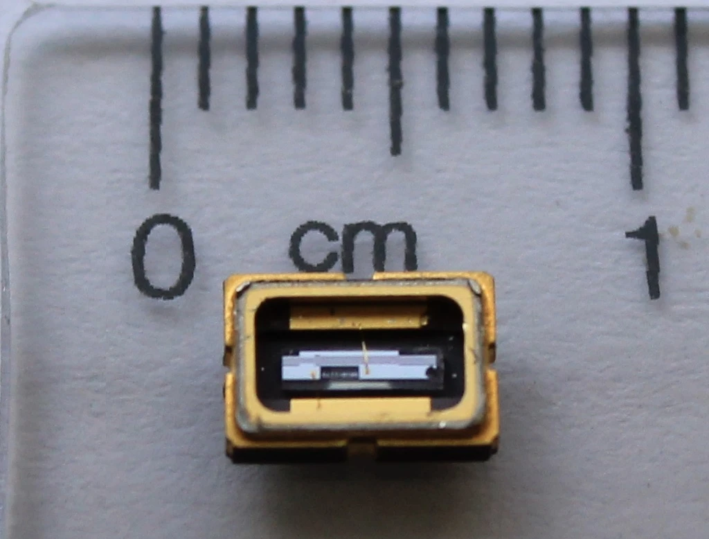 A droplet of blood is simply placed onto a microchip which is slotted into the device
