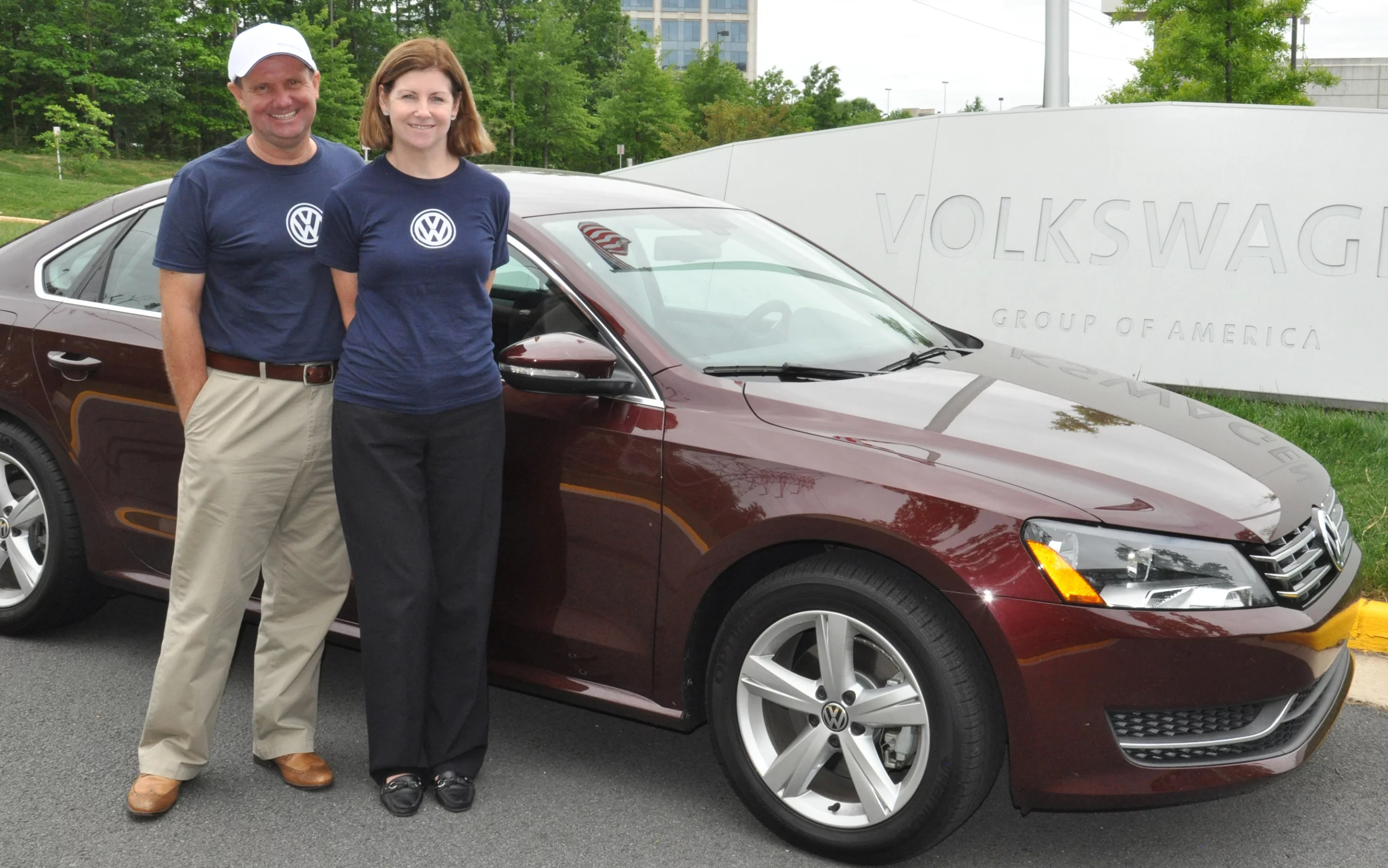 John and Helen Taylor beside the VW Passat they traveled 1,626.1 miles in on one tank of diesel