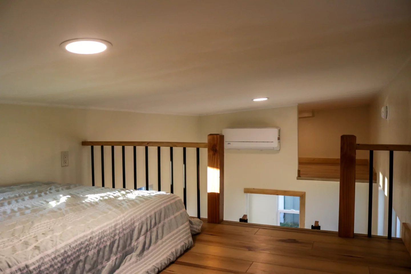 The Agatha's master bedroom contains a double bed and overlooks the living room