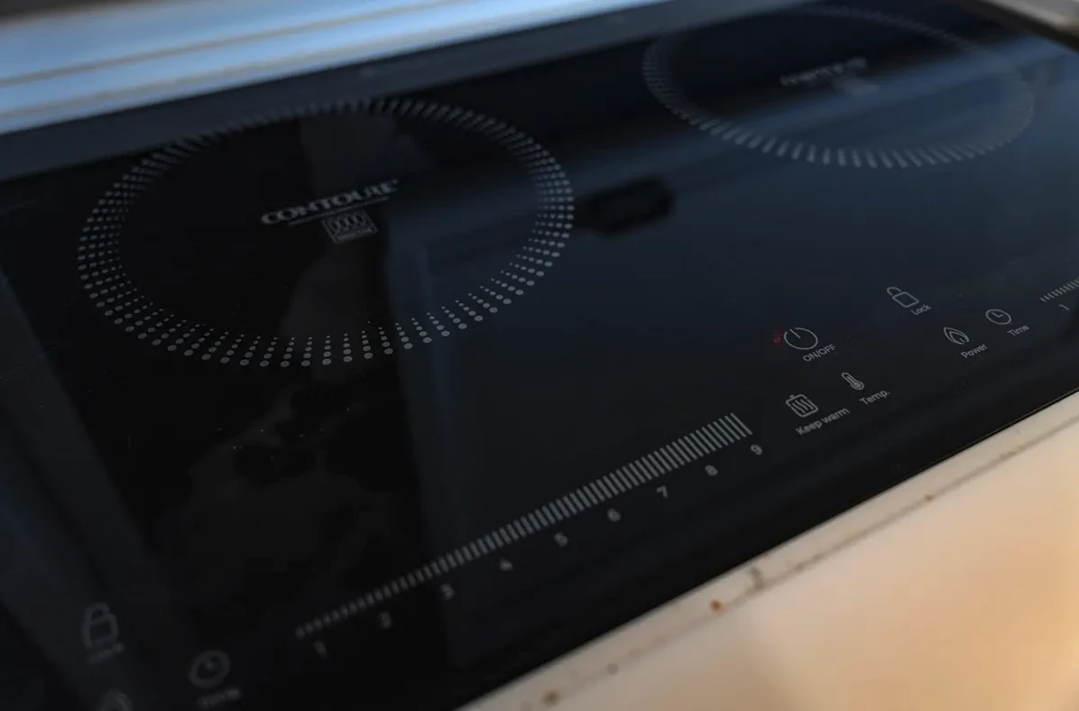 The Storyteller Hilt camper truck has an induction cooktop powered by the lithium battery system