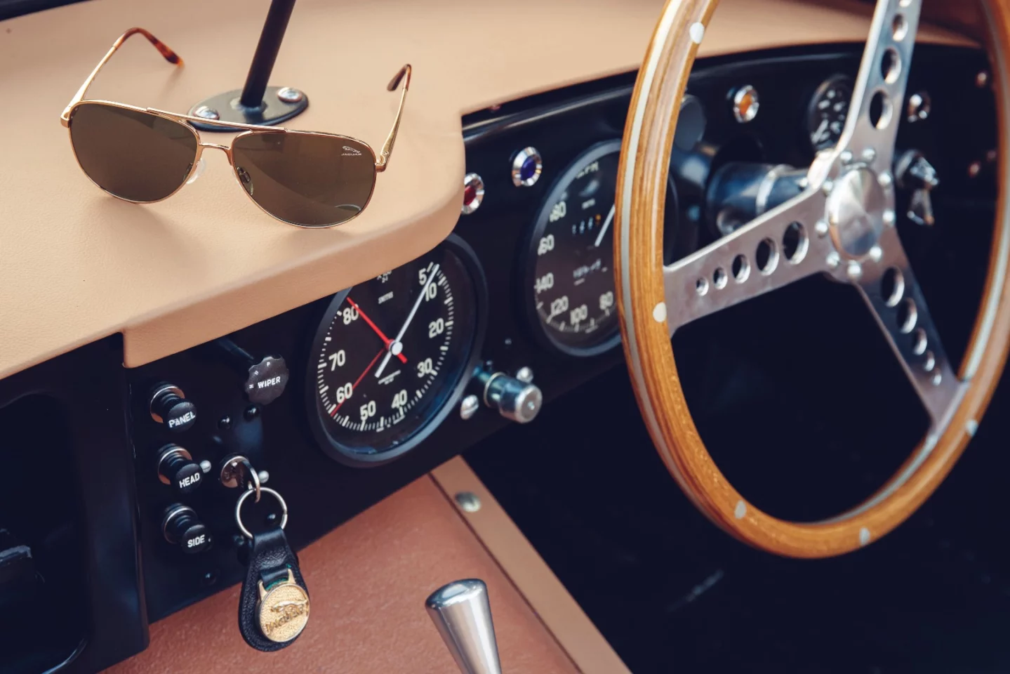 The interior includes authentic leather, wood and bronze