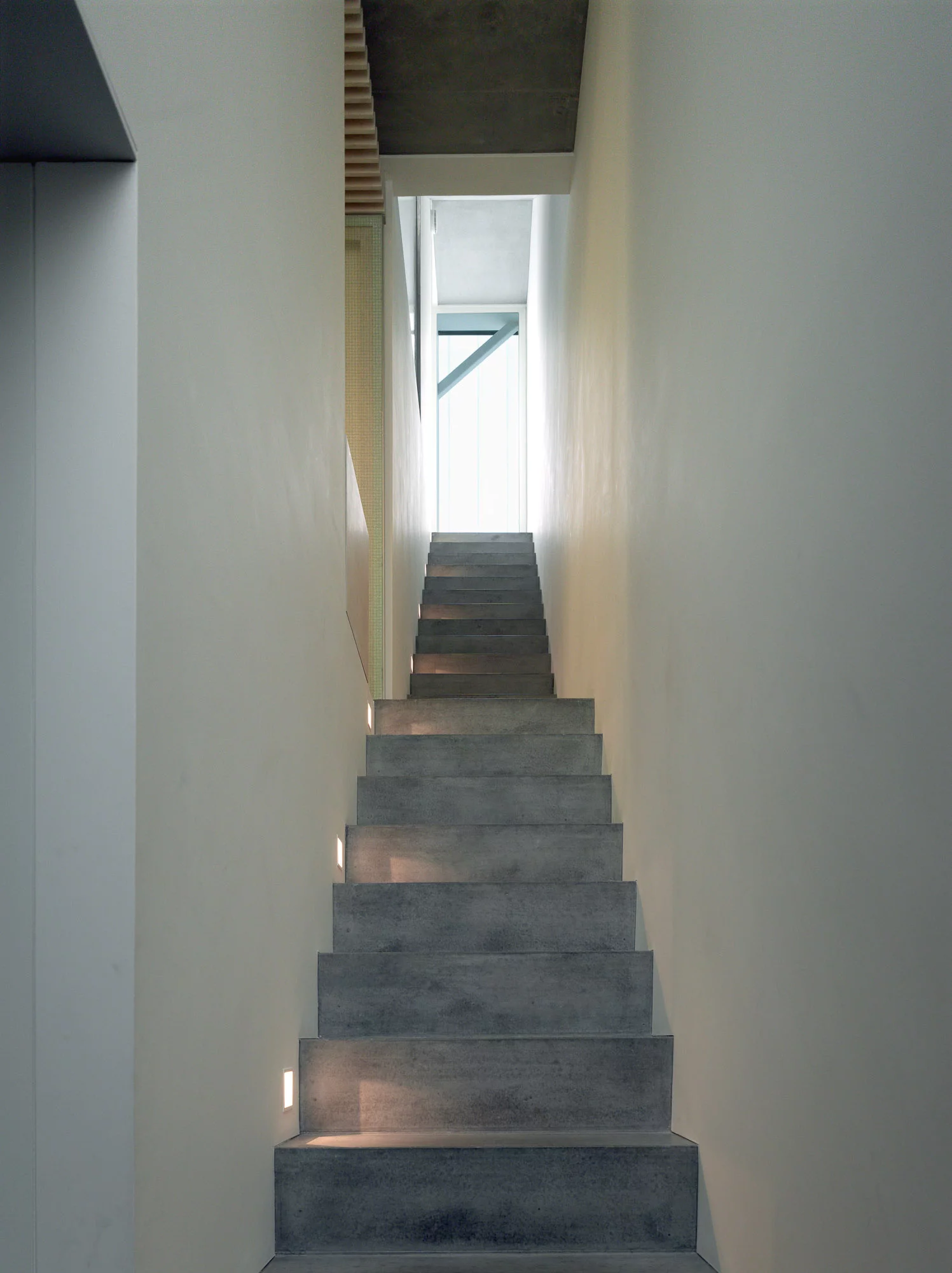 The upper box is the primary living space, and connects to a private roof terrace with wildflower garden