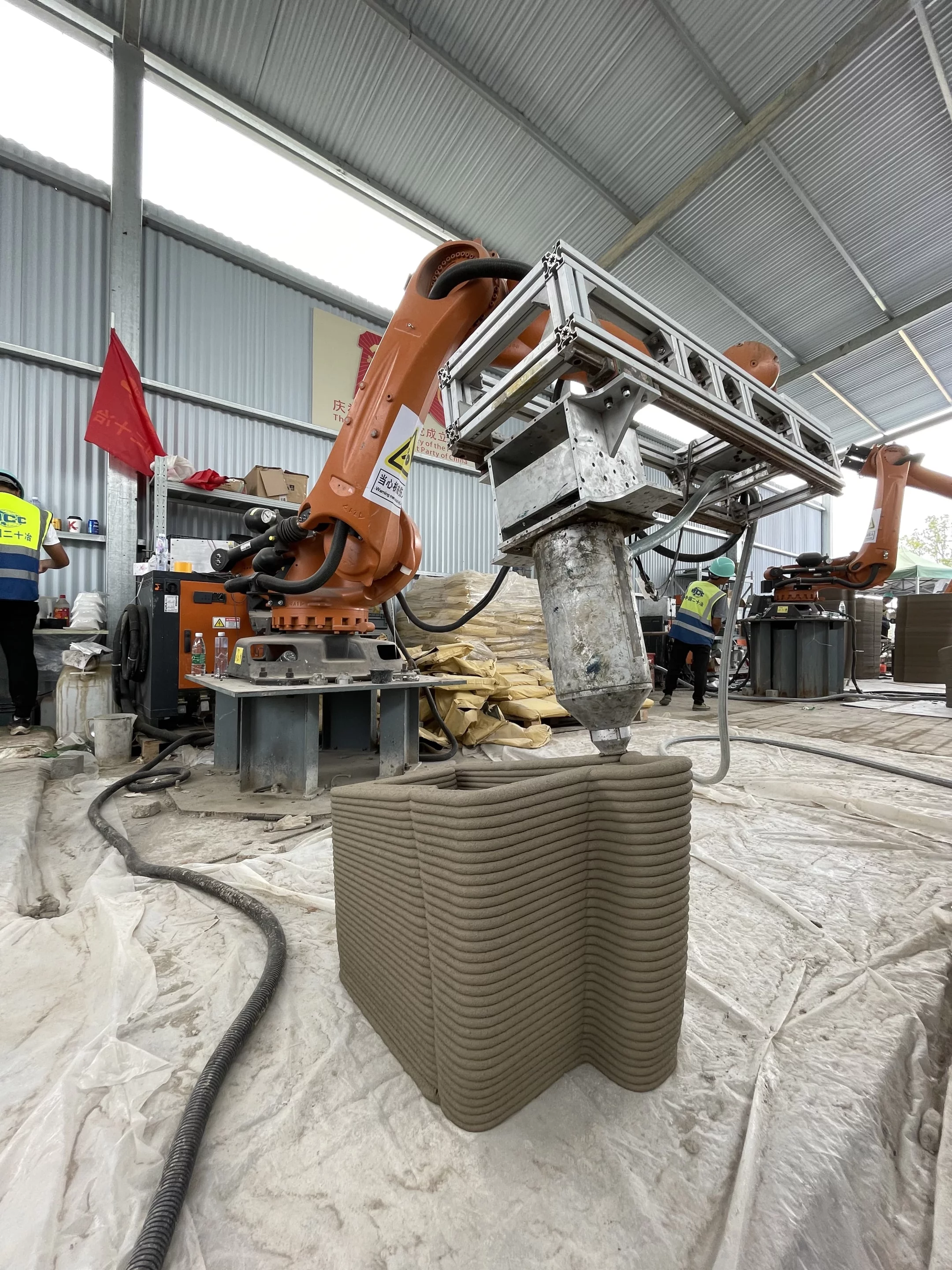 The printing process worked much like previous 3D-printed projects we've reported on and involved extruding a cement-like mixture out of a nozzle in layers, until the structure was complete