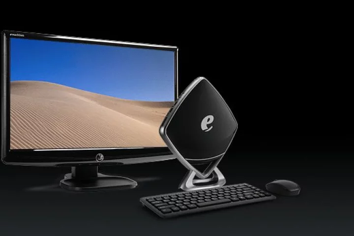 The glossy black diamond shape of the Mini-e from eMachines could well see it take front stage on a user's desk instead of being hidden behind monitors like others of its kind