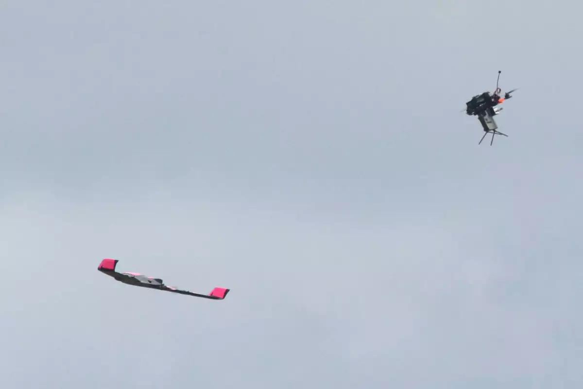 Quadcopter with Claymore (right) engages SkyRaider drone