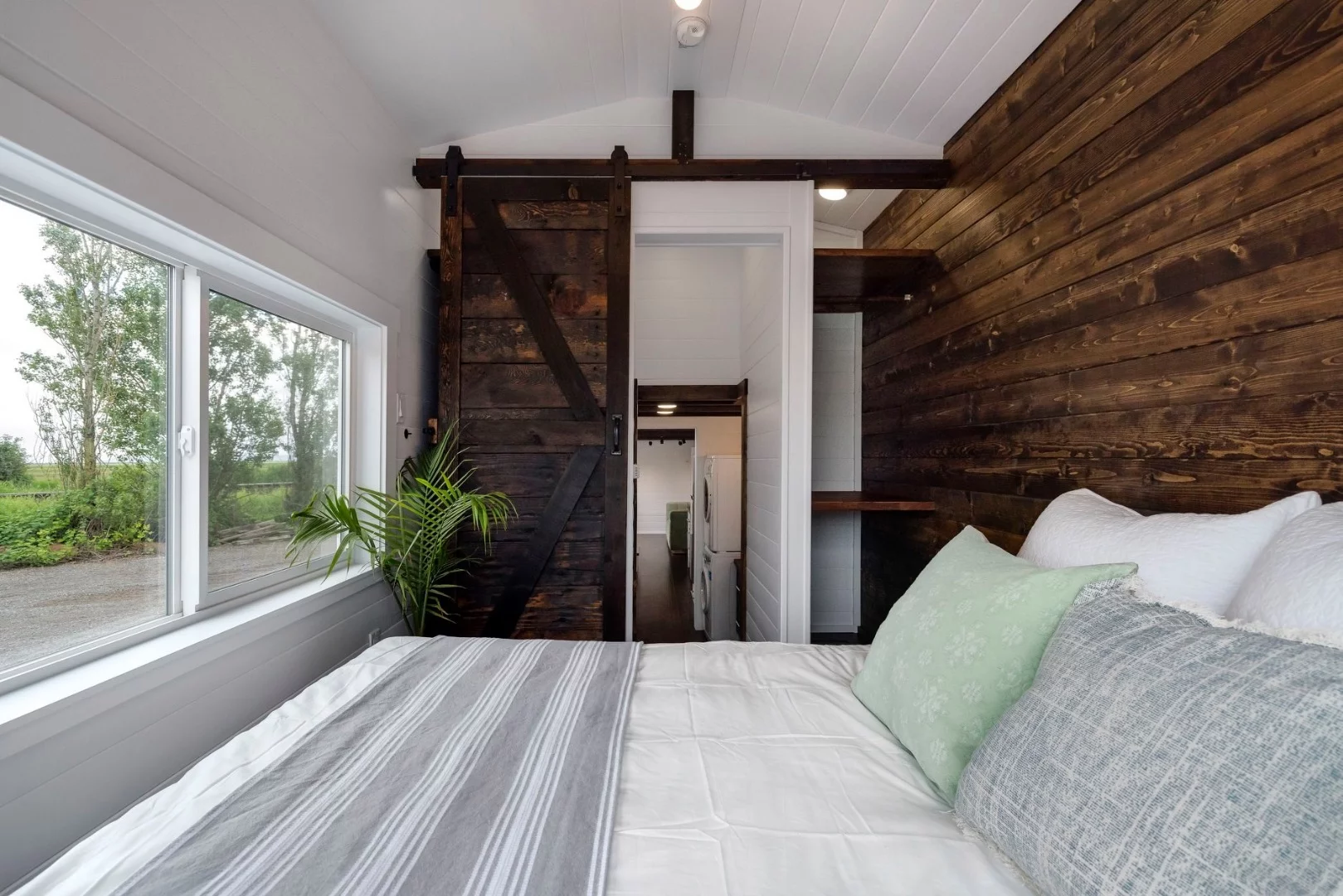 The Canada Goose's main bedroom is accessed by sliding barn-style door