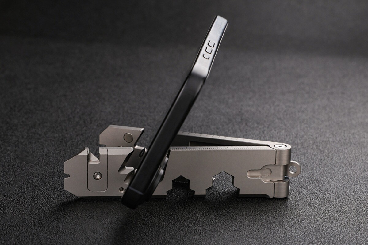 Tiny titanium phone stand puts 12 EDC tools on your keyring