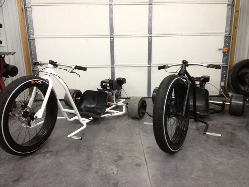 The trike is set in motion with a twist throttle fixed to the aluminum bars
