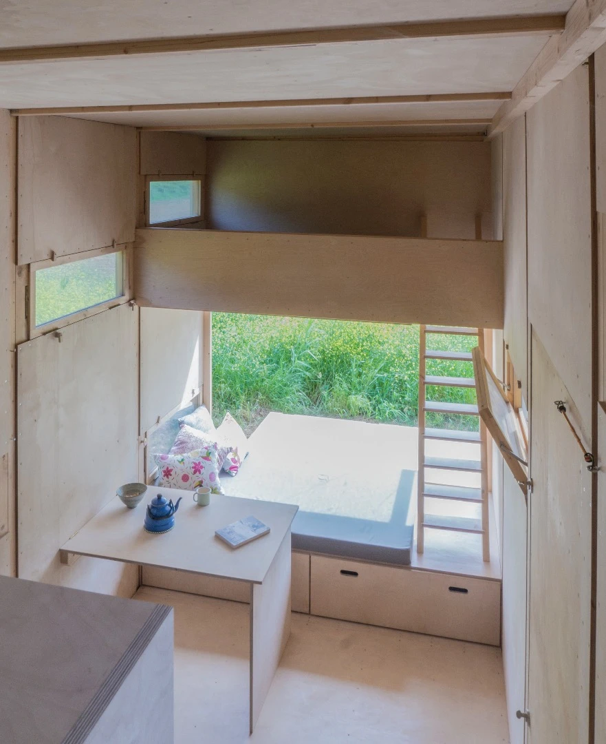 The Cabin on the Border has a nice simple layout including daybed and two loft-style bedrooms