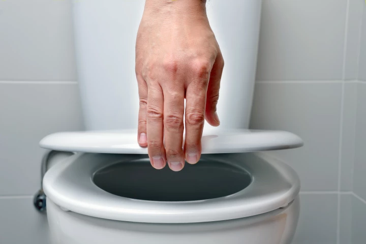 An automatic toilet flushing device can reduce bacterial spread