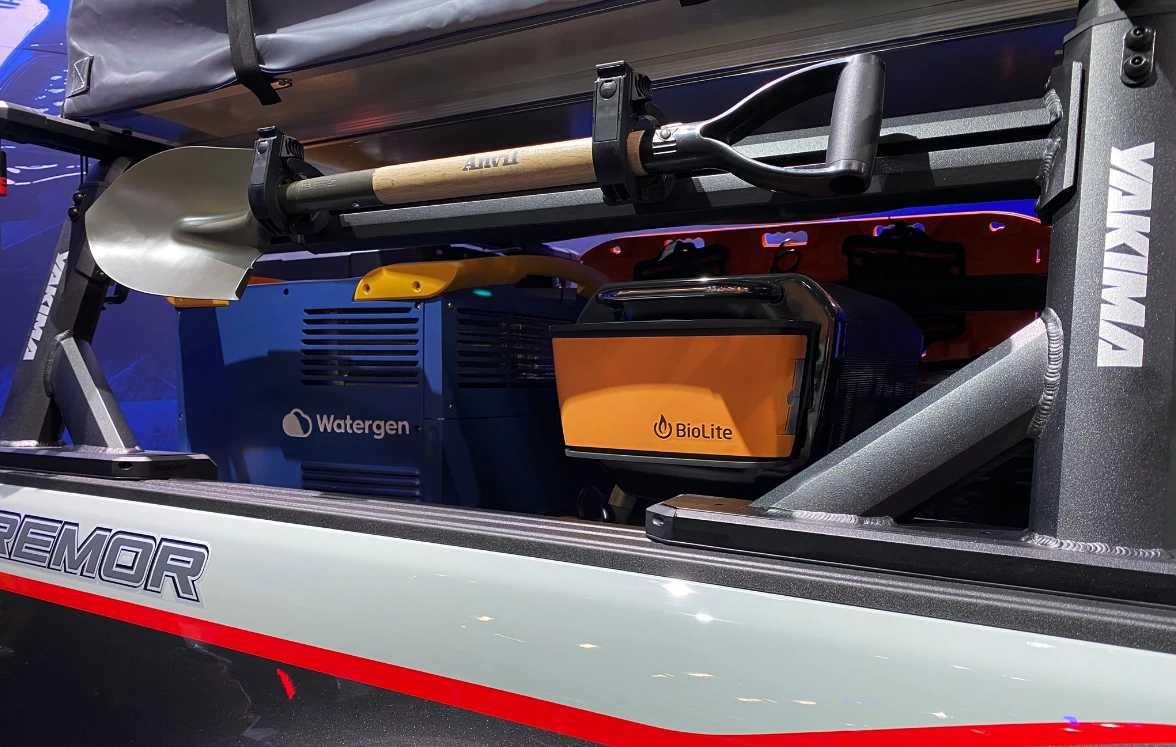 A different style of off-grid overland kitchen, Ford puts the Watergen Mobile Box to work next to a BioLite firepit/grill and slide-out fridge/freezer