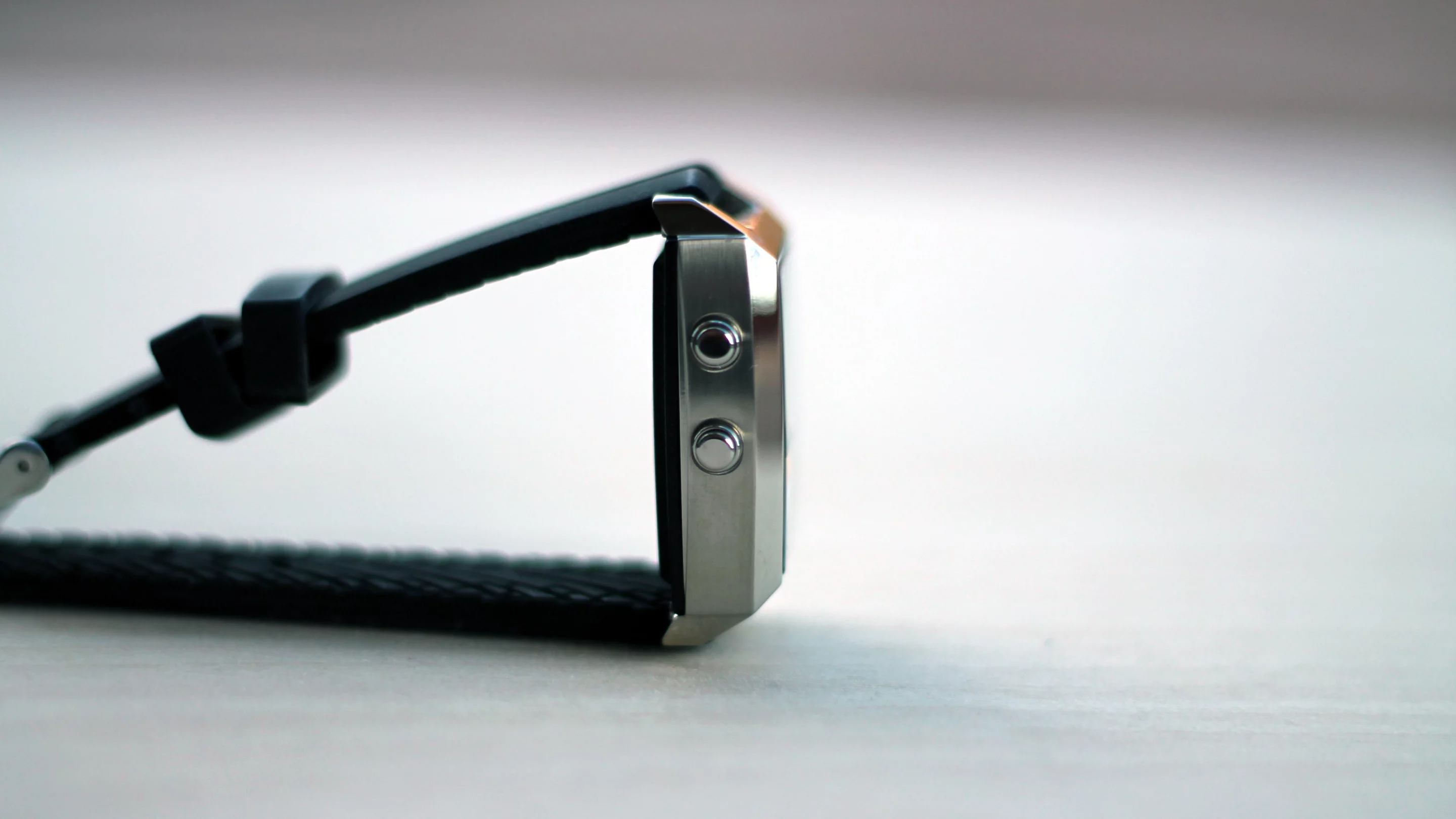 The bottom button lets you check the date and weather as well as reject calls, while the top button answers calls and activates voice control