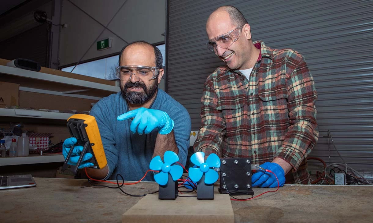 Dr Shahin Heidari (left) and Dr Seyed Niya, bemusedly posing for press photos with a multimeter and their prototype
