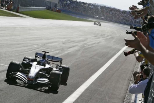 Raikkonen would be in with a shot at the title if his McLaren had been reliable - at least his win kept the title alive.