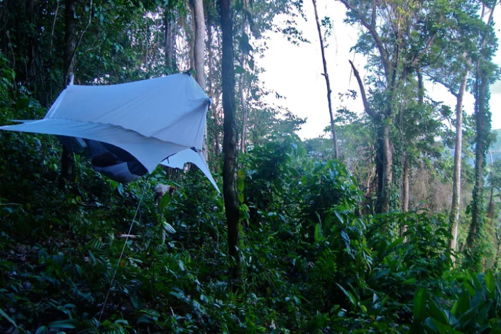 The Nube attaches to any camping hammock to form a completely enclosed shelter that keeps you and your gear off the ground in almost any location