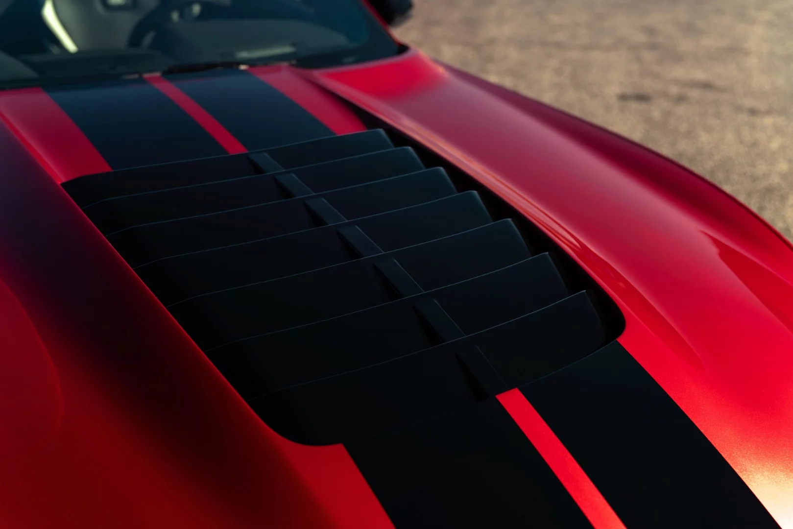 The large hood vent on the Mustang Shelby GT500 has a removable aluminum catch pan underneath and the entire unit can be removed for improved airflow in performance driving