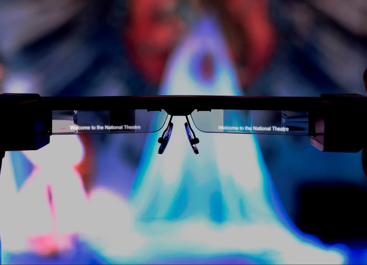 Dialog from an on-stage performance appears directly on the lenses as text