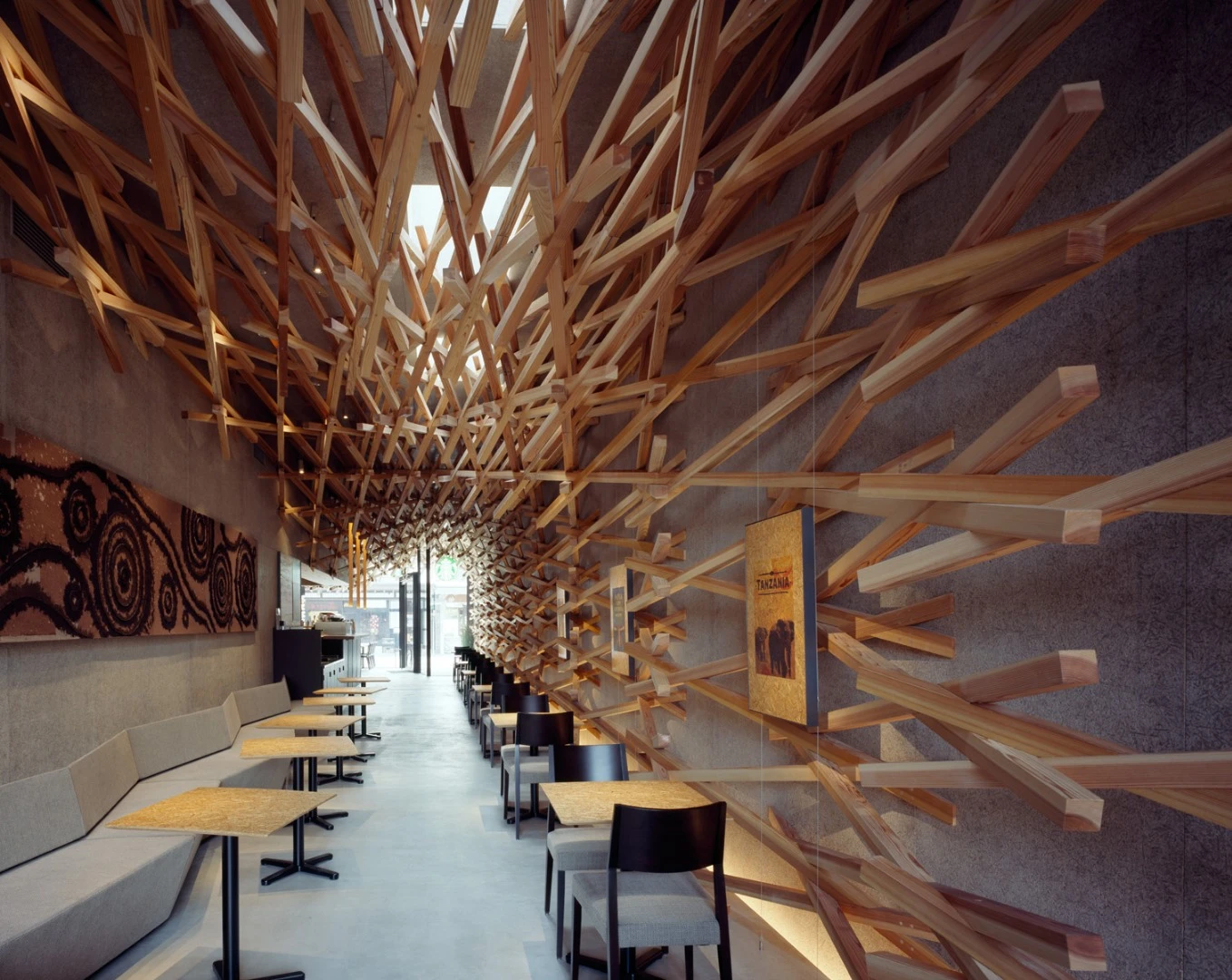 The interior of this Starbucks Coffee shop in the Tokyo suburb of Omotesando is made to create an "organic space that flows like light and wind." By Kengo Kuma & Associates