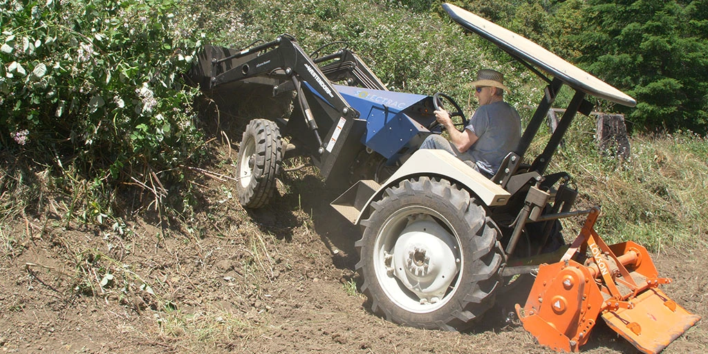 The eUtility Electric Tractor, seen here with its front loader