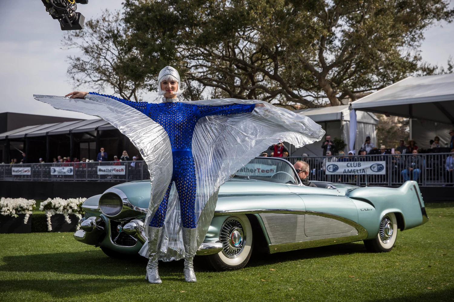 The 1951 LeSabre was General Motors' first post-war concept car. First shown in December 1950, the two-passenger convertible was unabashedly styled on the F-86 LeSabre jet fighter aircraft. Design elements include a "front-intake" nose cone, wraparound cockpit windshield, tall tail fins and a barrel-shaped trunk with glowing "afterburner" brake light. The chassis and driveline were provided by Buick Engineering. The 335 hp supercharged aluminum V-8 engine ran on both gasoline and methanol with two separate fuel tanks and two carburetors. A moisture sensor raised the convertible top if it began raining when the car was parked. From the General Motors Heritage Collection, the LeSabre won the HVA National Automotive Heritage Award for the most historically significant vehicle.