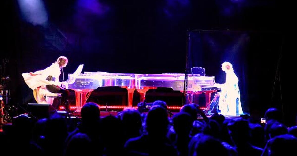 Japanese Rockstar Yoshiki Engages In Piano Battle With Hologram Of Himself