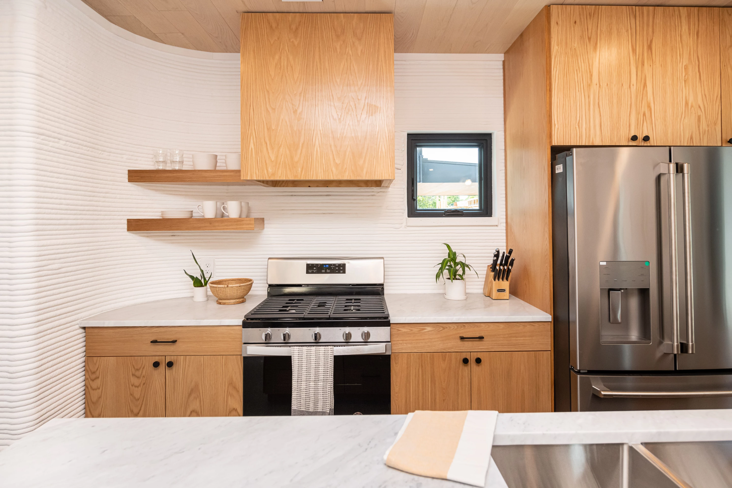 The East 17th St 3D-printed Home Development's kitchens include stainless steel appliances