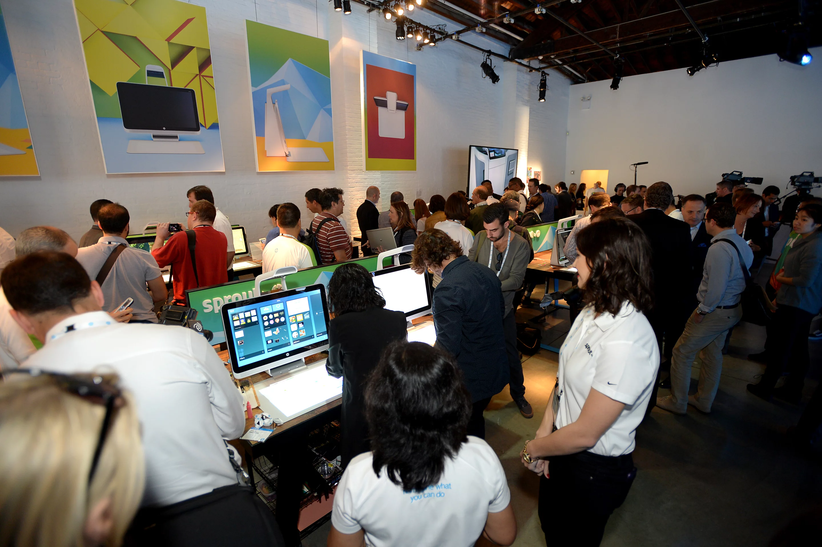 Overhead scanning technology can create 3D-like images of objects placed on the mat, which appear on the vertical display