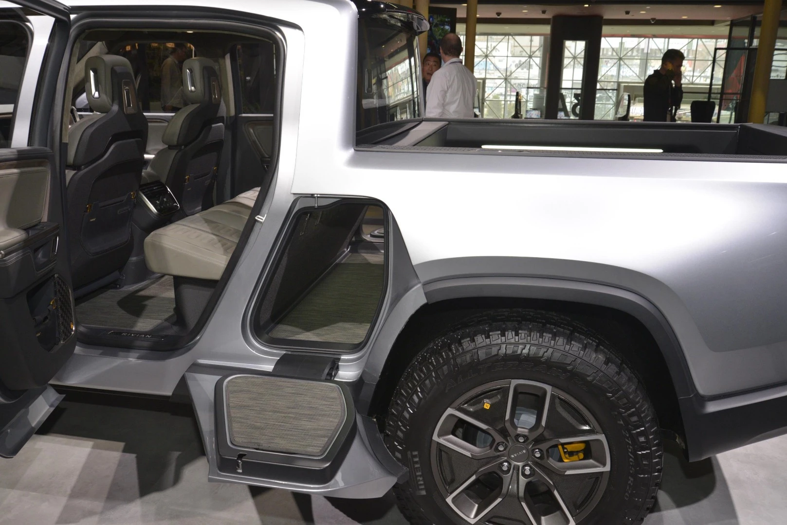 Rivian highlights the fore-axle pass-through storage compartment on the R1T electric pickup