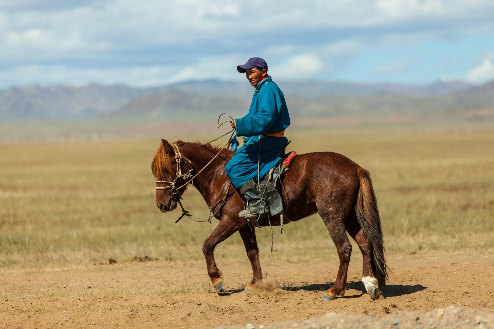 Local herder on horseback, beside the Chinese trans-mongolian highway that's currently under construction. Between Tsaaganuur and Ayag nuur