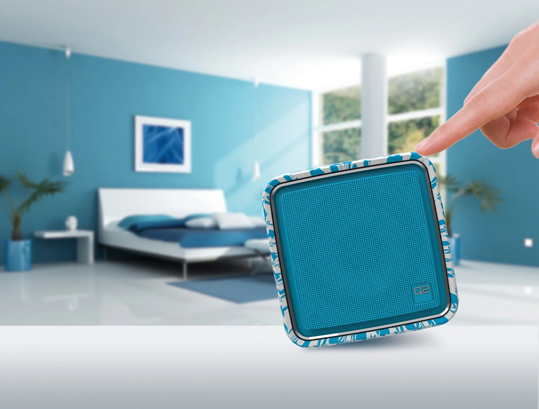 The Q2 Internet Radio has its four pre-allocated stations changed by tipping the device onto its side, its volume adjusted by raising or lowering the front end, and is muted by placing the speaker face down