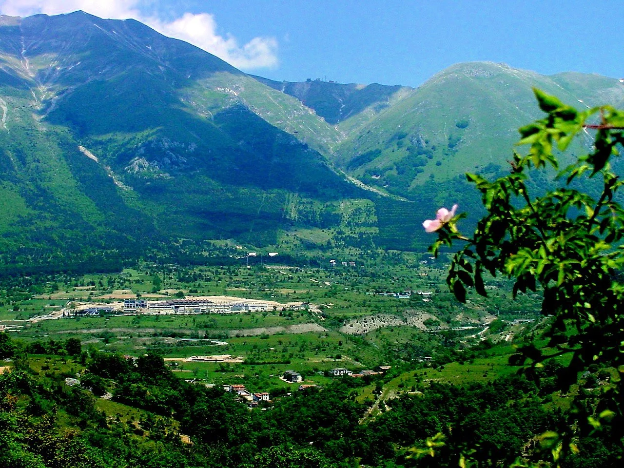 The Gran Sasso National Laboratory nestles far under the idyllic scene shown here (Photo: Gran Sasso National Laboratory)